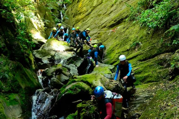 a man riding a bike down a dirt road