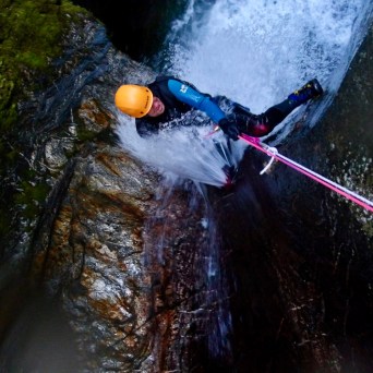 Abseiling through whitewater