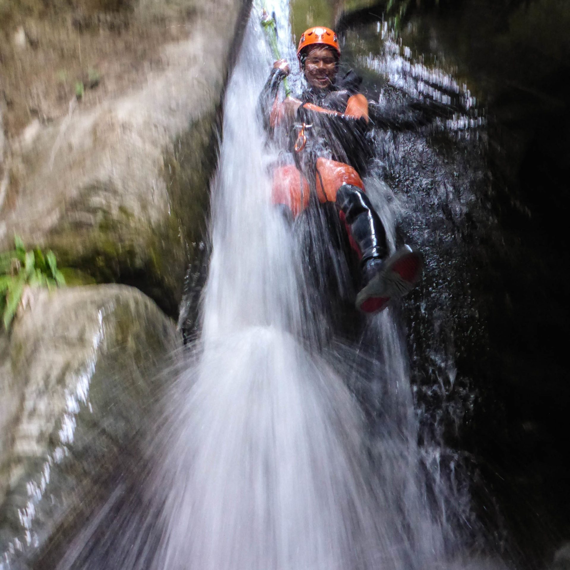 a man riding on the back of a waterfall