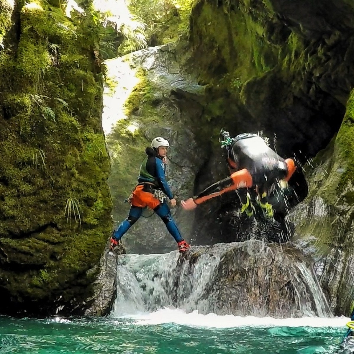 a man riding on the back of a waterfall