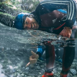 a child swimming in a body of water