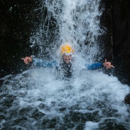 a man enjoying a waterfall