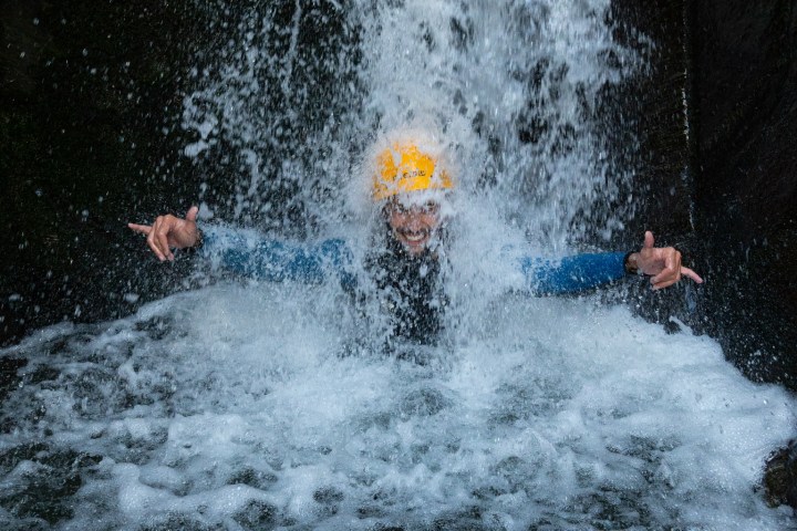 a man enjoying a waterfall