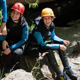 Two people sitting in the canyon