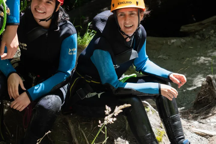 Two people sitting in the canyon
