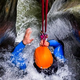 A person getting ready to slide into the canyon