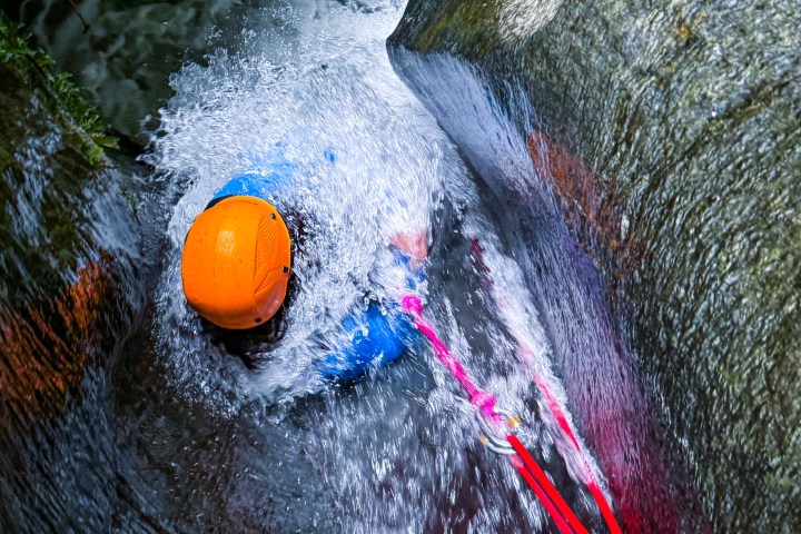 Sliding down natural waterfalls