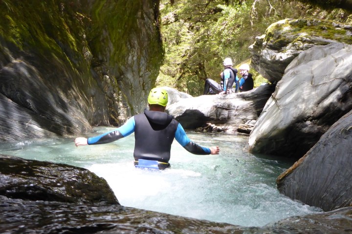 a person walking through the canyon
