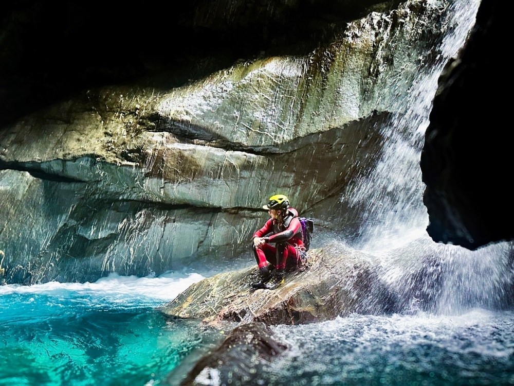 a man riding on the back of a waterfall