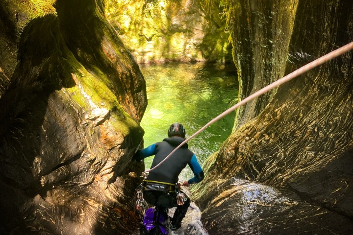 a man riding on the back of a waterfall
