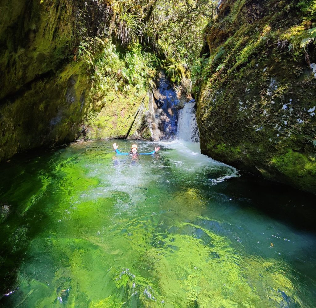 a large waterfall over a body of water