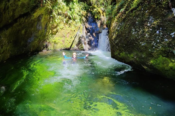 a large waterfall over a body of water