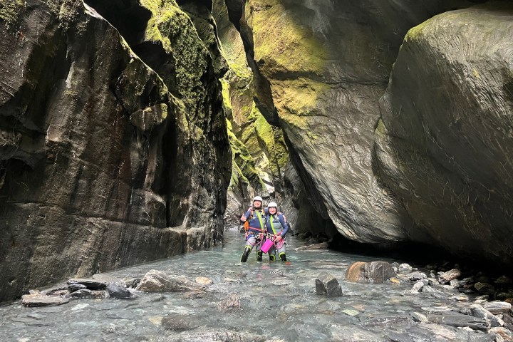 a person riding on top of a rock