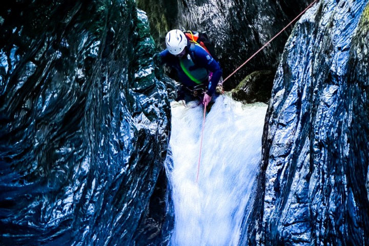 a man riding skis down a snow covered slope