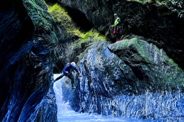 a large waterfall over some water