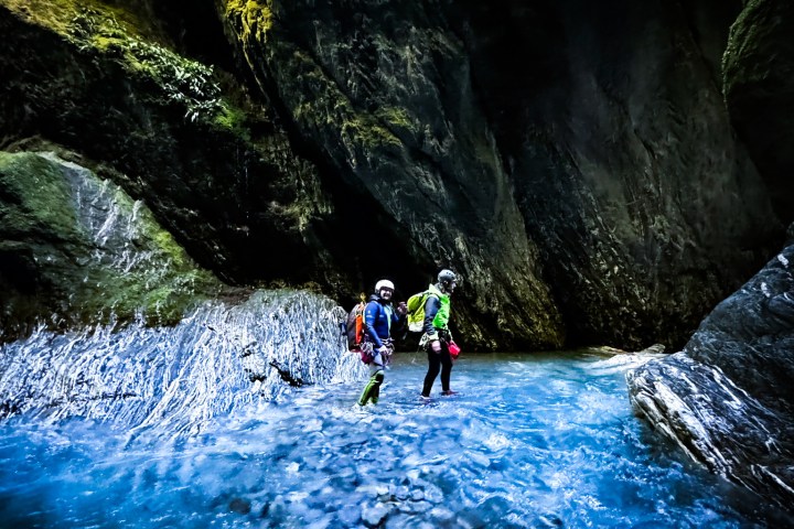 a group of people riding skis on a snowy mountain