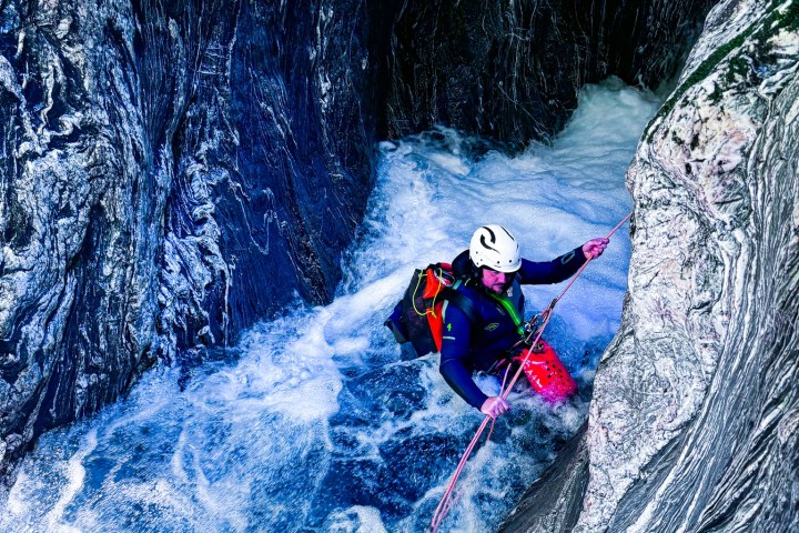 a man riding a wave on a surfboard in the water