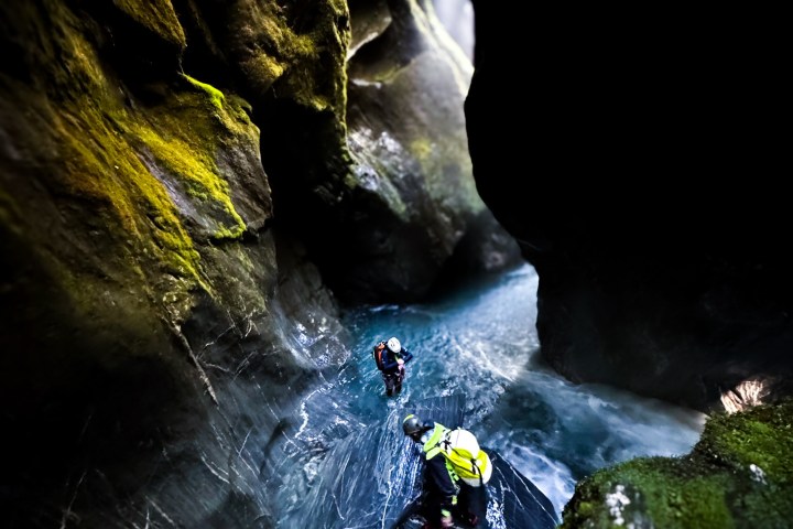 a large waterfall over some water