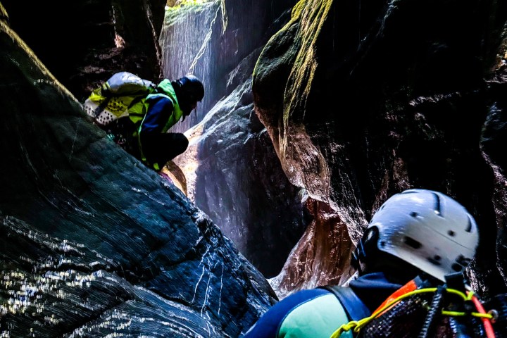 a man flying through the air while riding skis