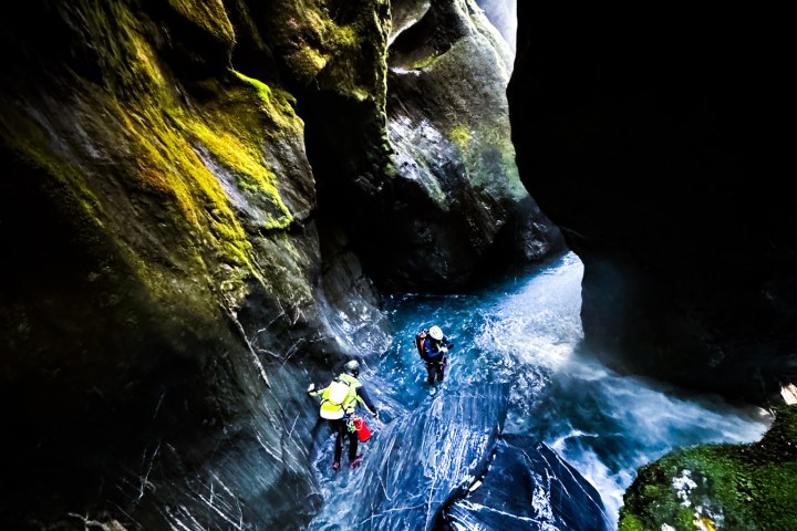 a large waterfall over some water