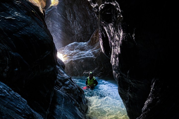 a large waterfall over some water