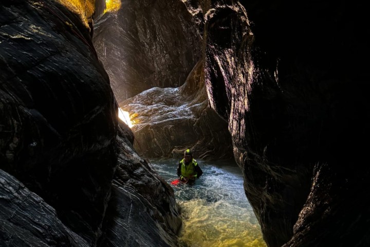 a large waterfall over some water