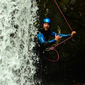 Standing behind a waterfall
