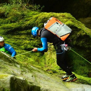 Abseiling down the rocks