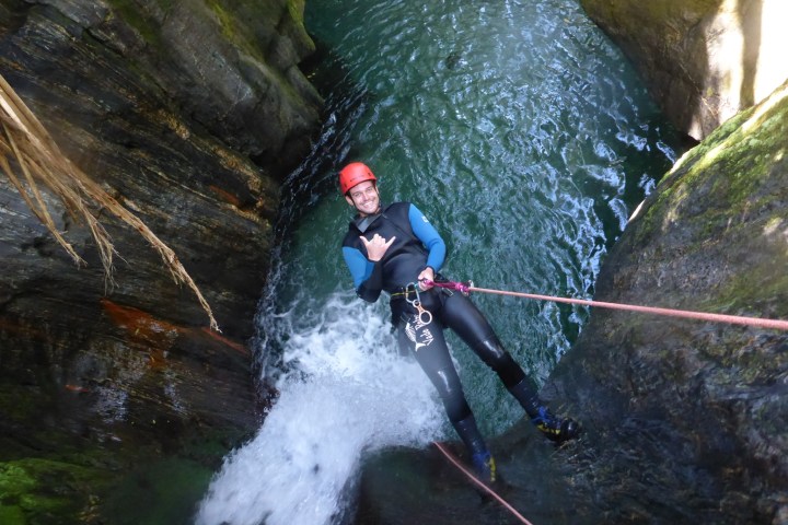 a man riding skis down a river
