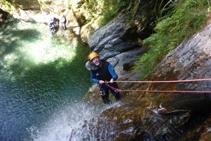 a man water skiing on a lake