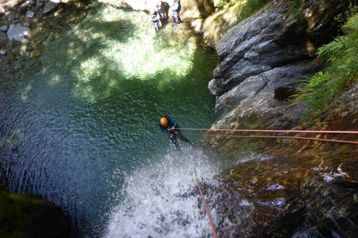 a man riding a wave on a surfboard in the water