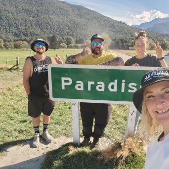 Standing by the Paradise sign in Glenorchy