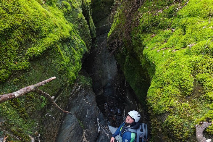 a man riding on the back of a waterfall