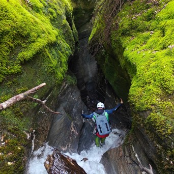 A man climbing down the canyon