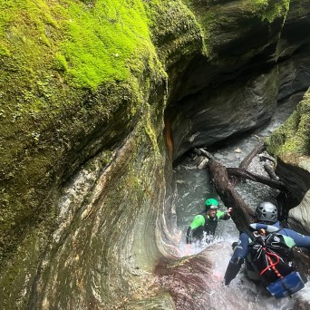a person standing next to a river