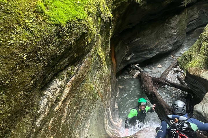 a person standing next to a river