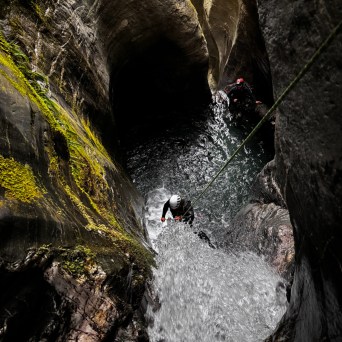 a large waterfall in a forest