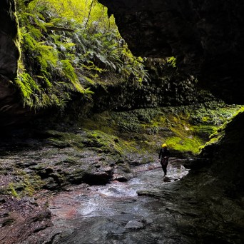 a large waterfall over a body of water