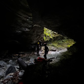a man riding a snow board in the water