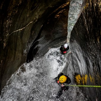 a person riding on the back of a waterfall