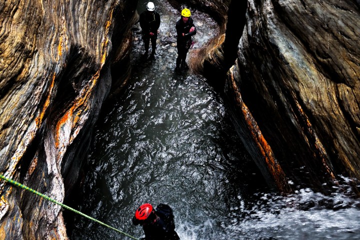 a person riding a snow board in the water