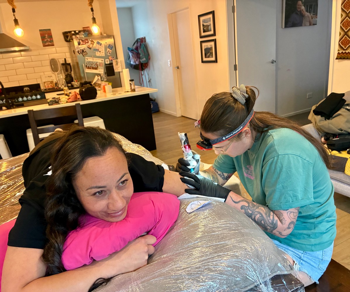 Marata getting her new tattoo from Kaylah